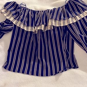 Beautiful navy blue and cream colored off the shoulder long sleeve shirt
